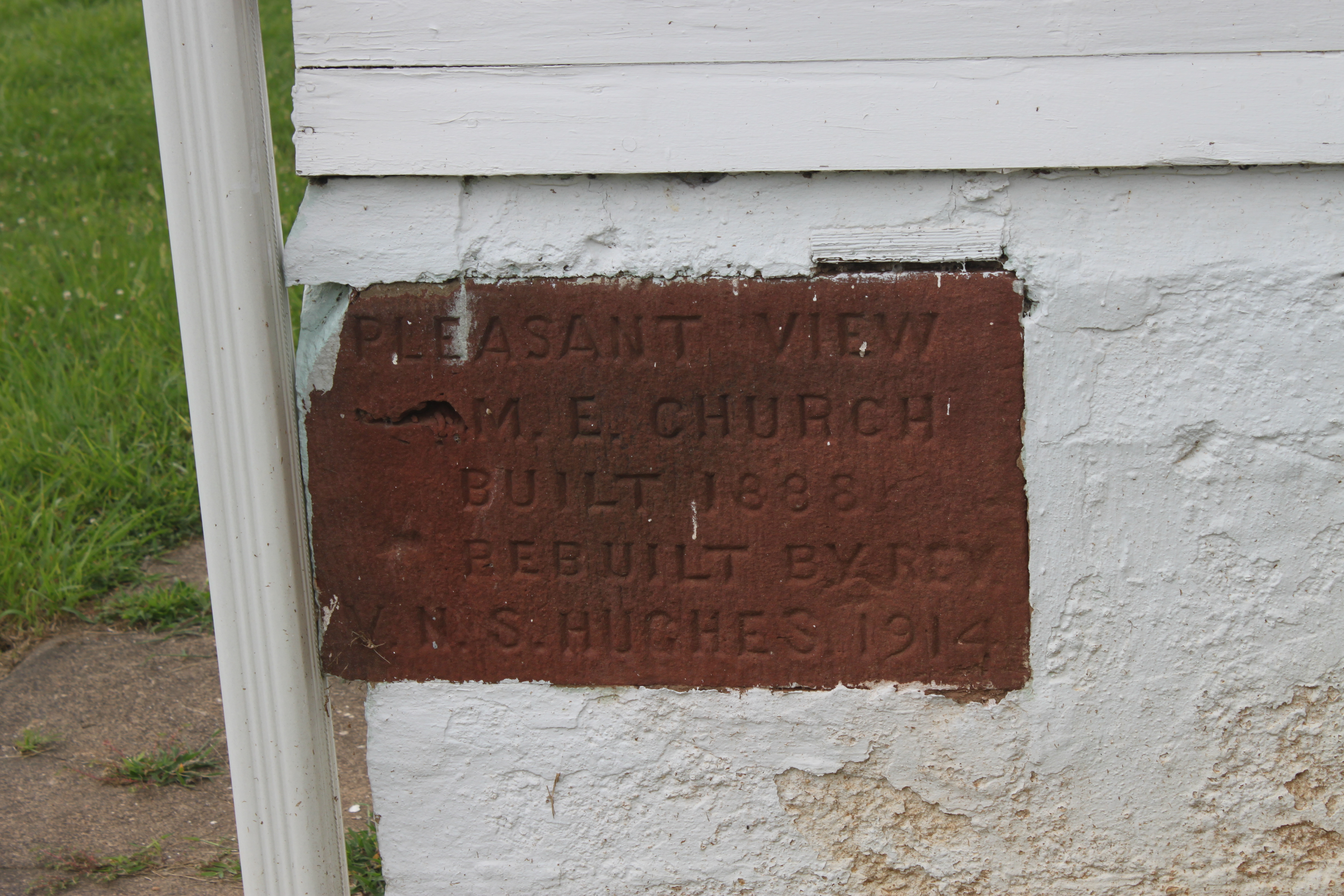 Cornerstone for Pleasant View Methodist Episcopal Church. It reads "Pleasant View M.E. Church, built 1888, rebuilt by Rev. N. S. Hughes, 1914."