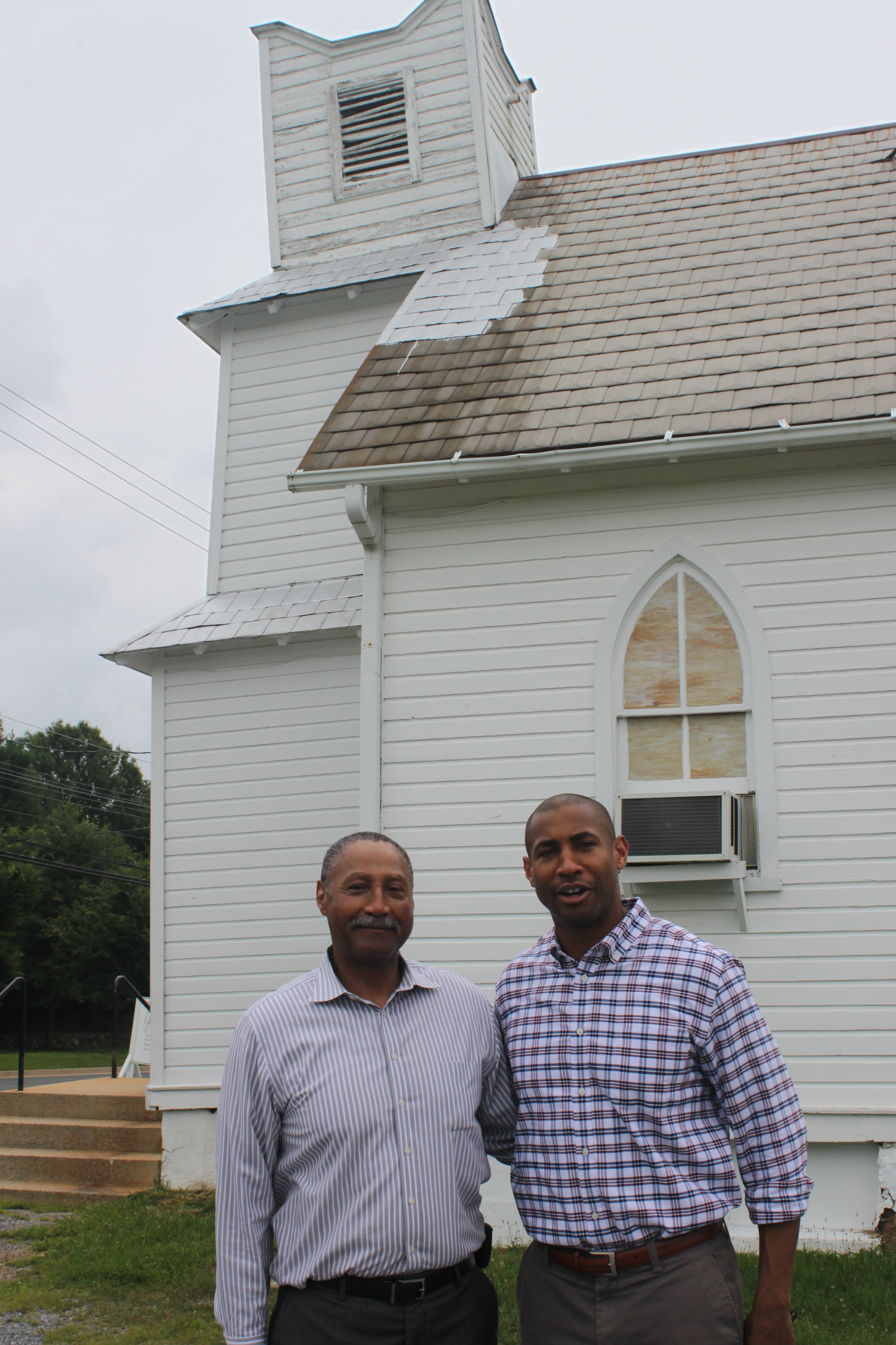 Rev. Gerard Green and Jason Green outside of Pleasant View Methodist Episcopal Church