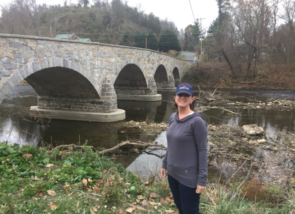 Image of Board Member Diane Caslow at the Antietam Ironworks bridge