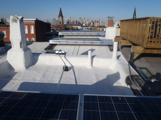 Solar panels on a historic flat roof. Photo by Maryland Historical Trust.