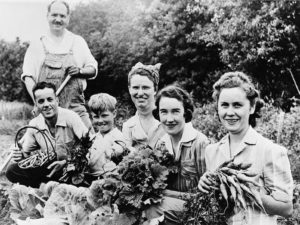 Some victory gardeners showing their fine vegetables, 1942. Photo from Library of Congress.
